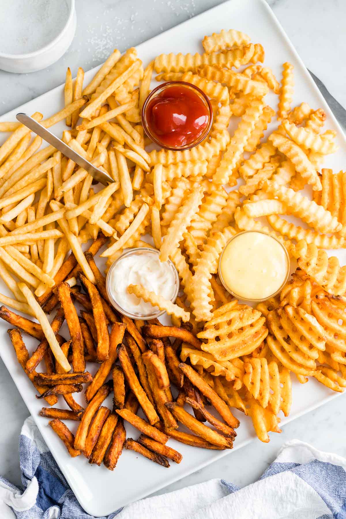 Air Fryer French Fries on a white plate served with dips