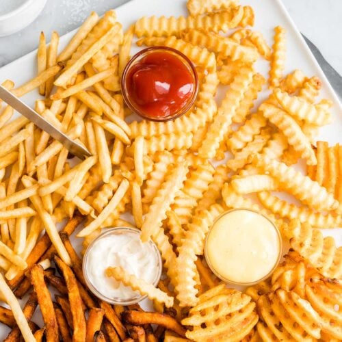 Air Fryer French Fries on a white plate served with dips