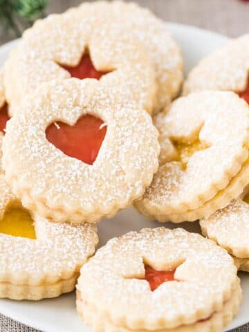 Linzer Cookies stacked on a plate