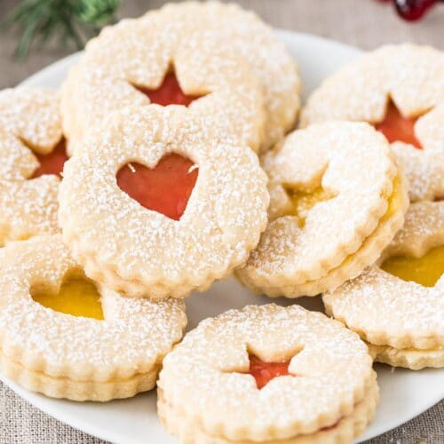 Linzer Cookies stacked on a plate
