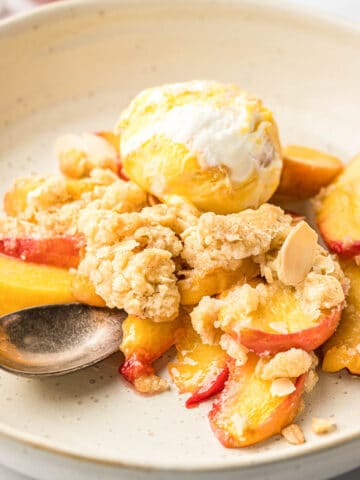 Peach crisp and ice cream on a plate