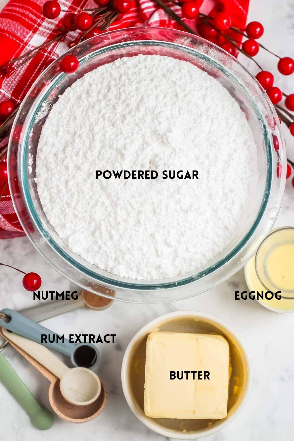 Ingredients for eggnog buttercream in different small bowls