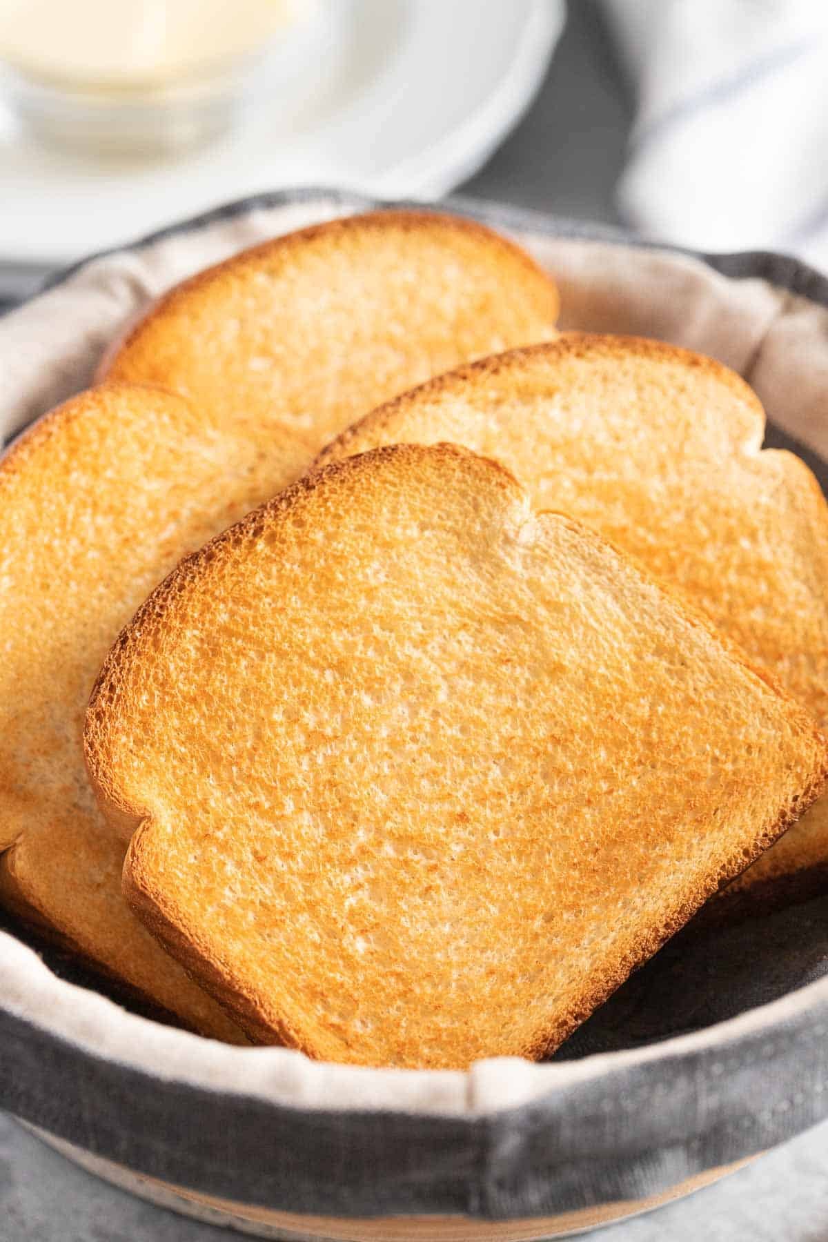 Toasted bread in a bread basket.