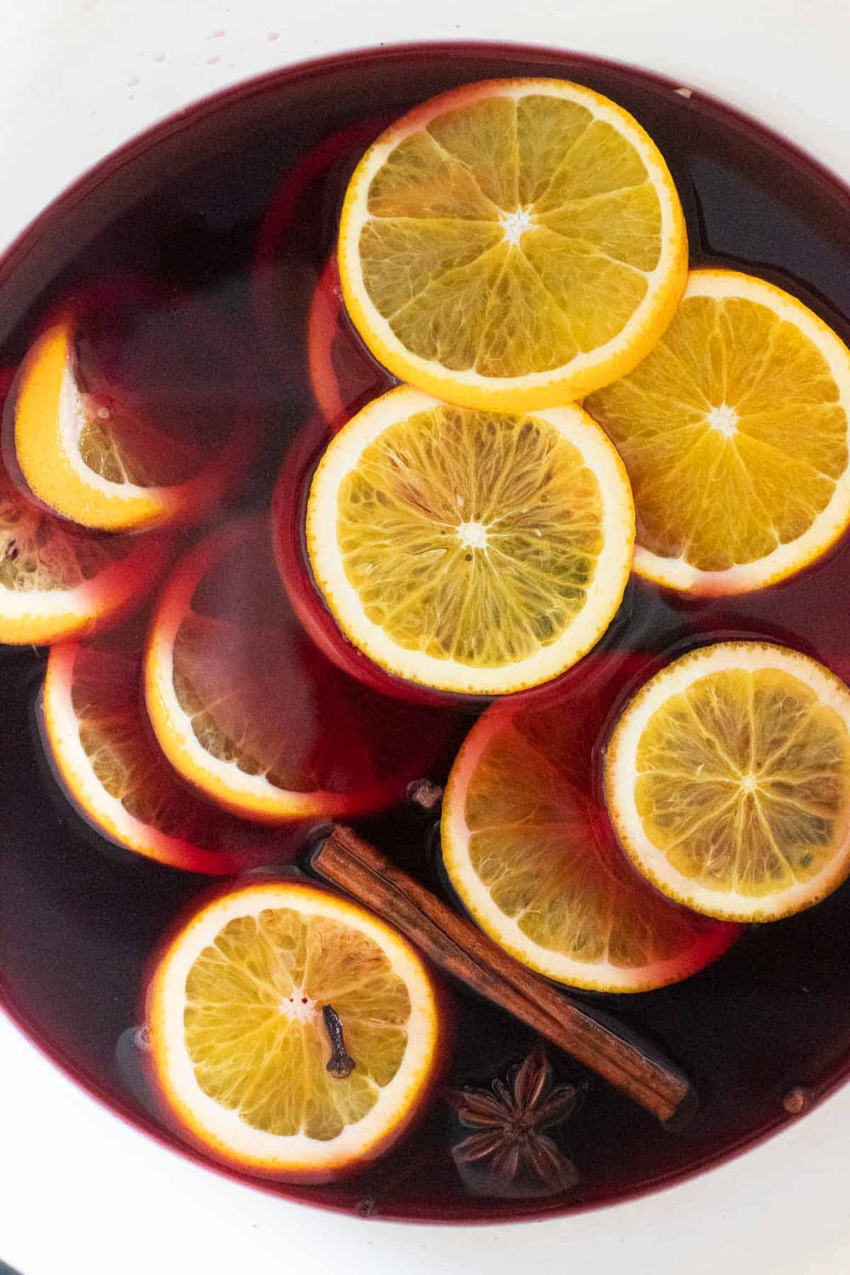 A pot filled with German mulled wine, orange slices floating in the liquid.