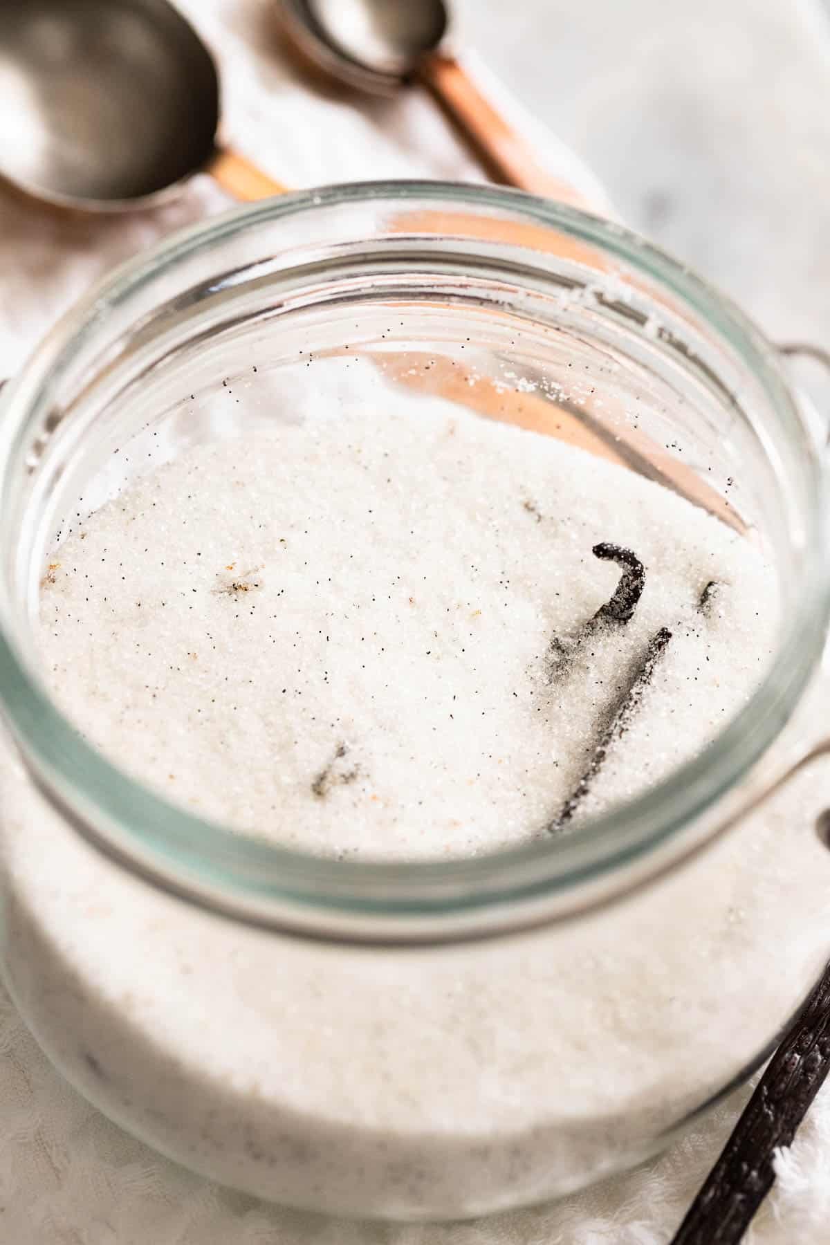 A large jar filled with vanilla sugar.