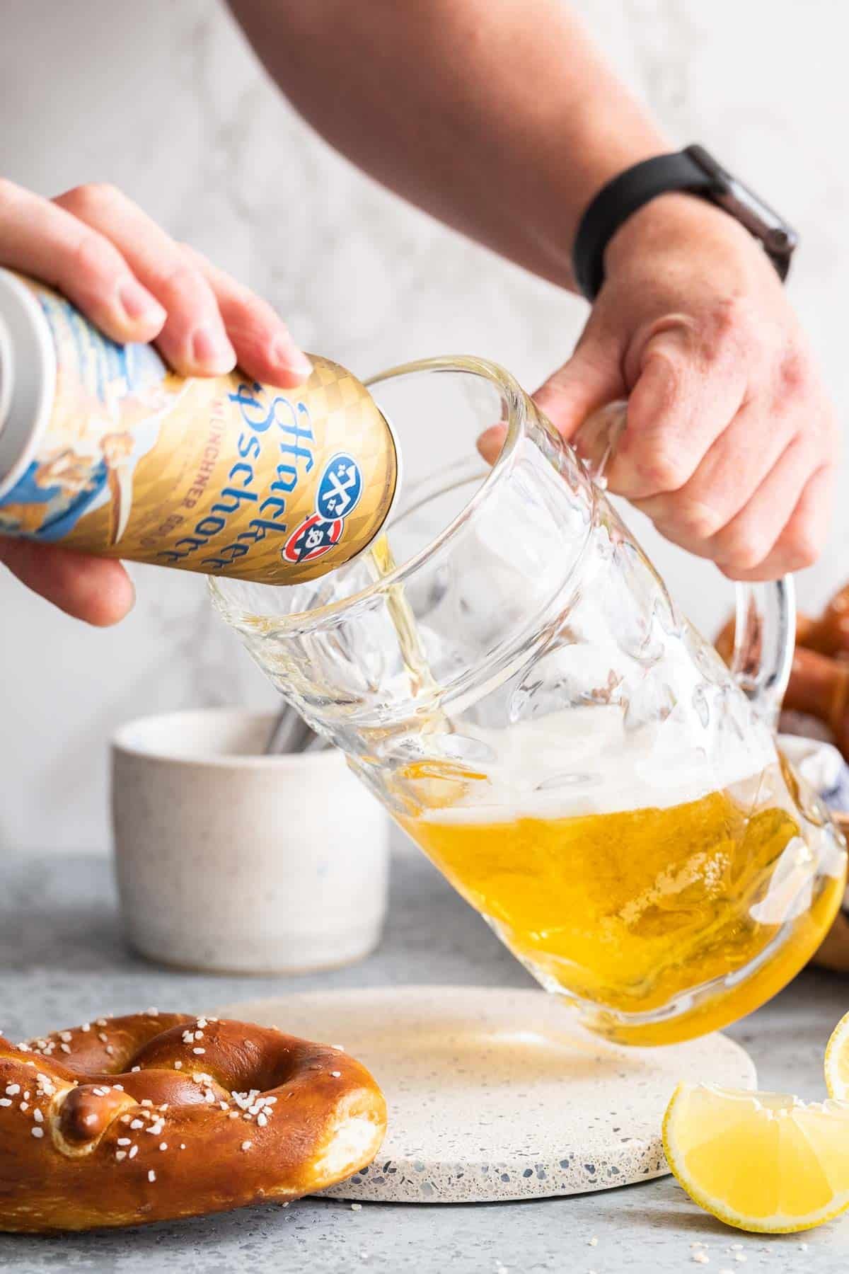 Beer being poured into a beer stein.