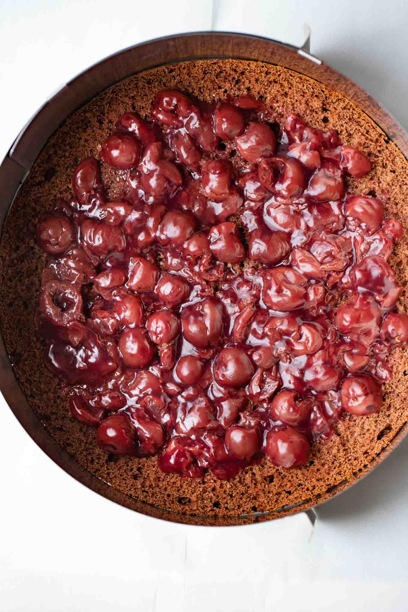 Cherry filling on a cake layer.