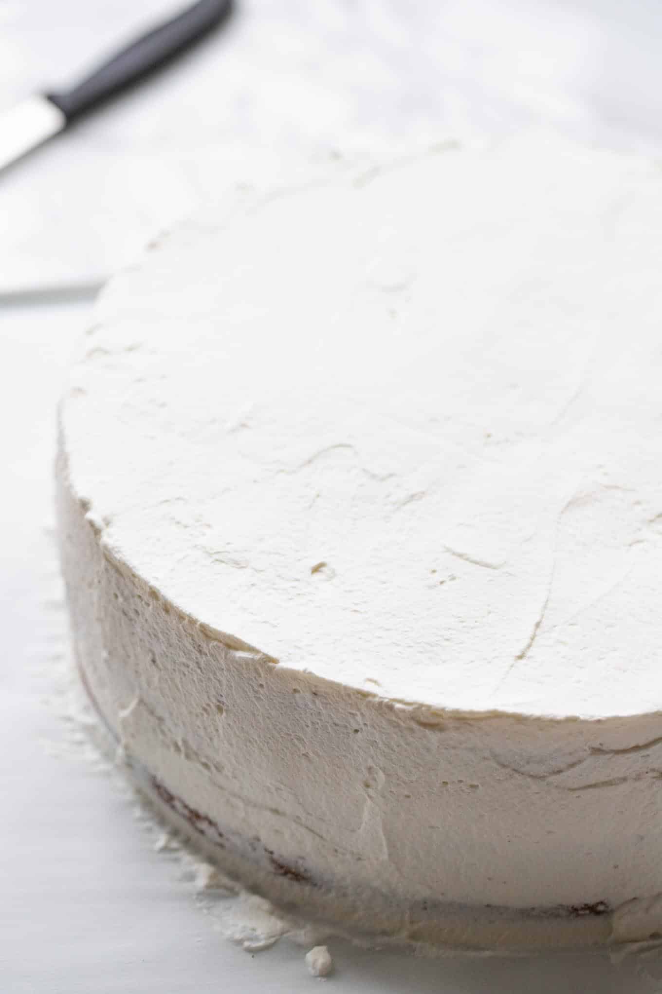 Cake frosted with whipped cream.