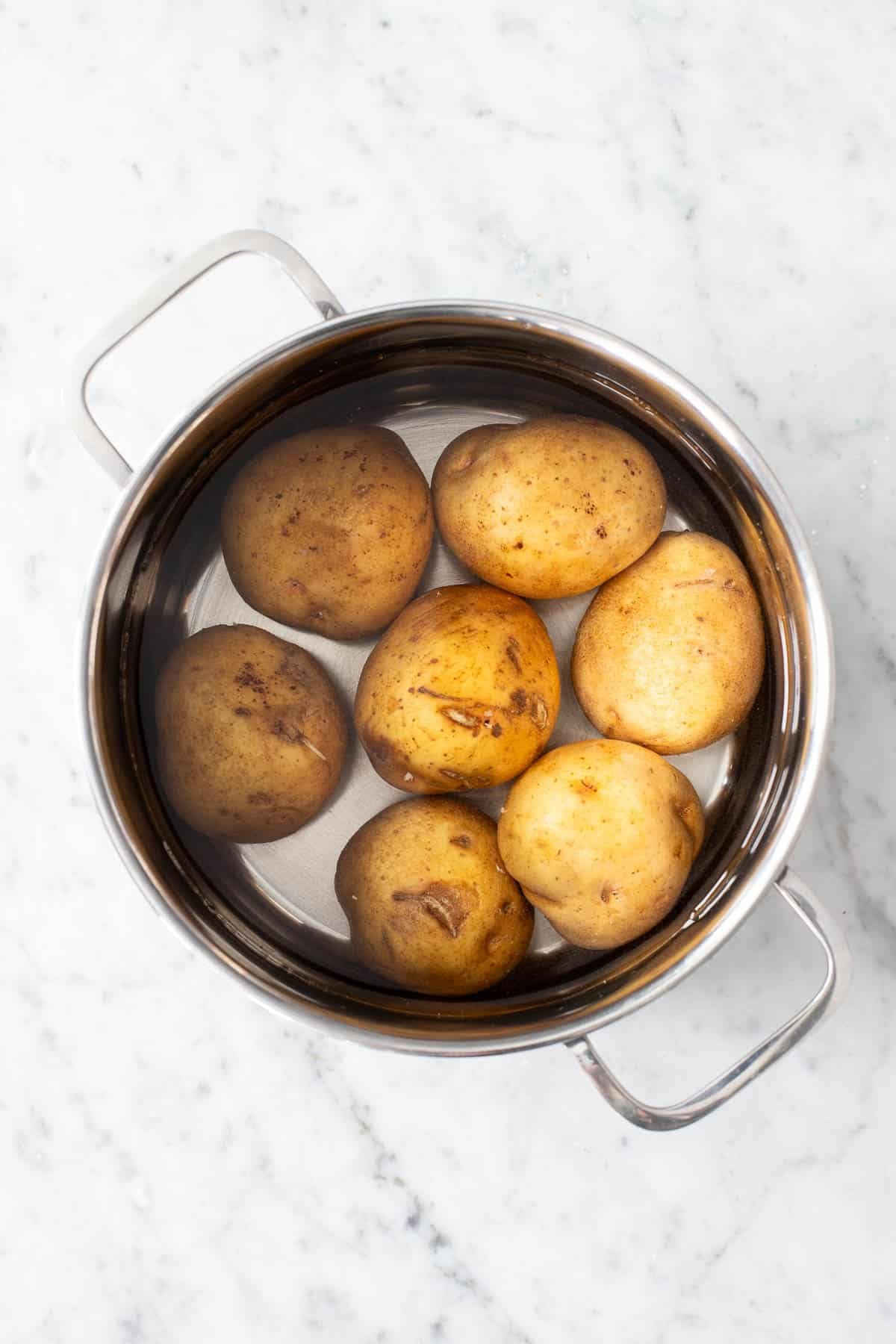 Potatoes in a pot with water.