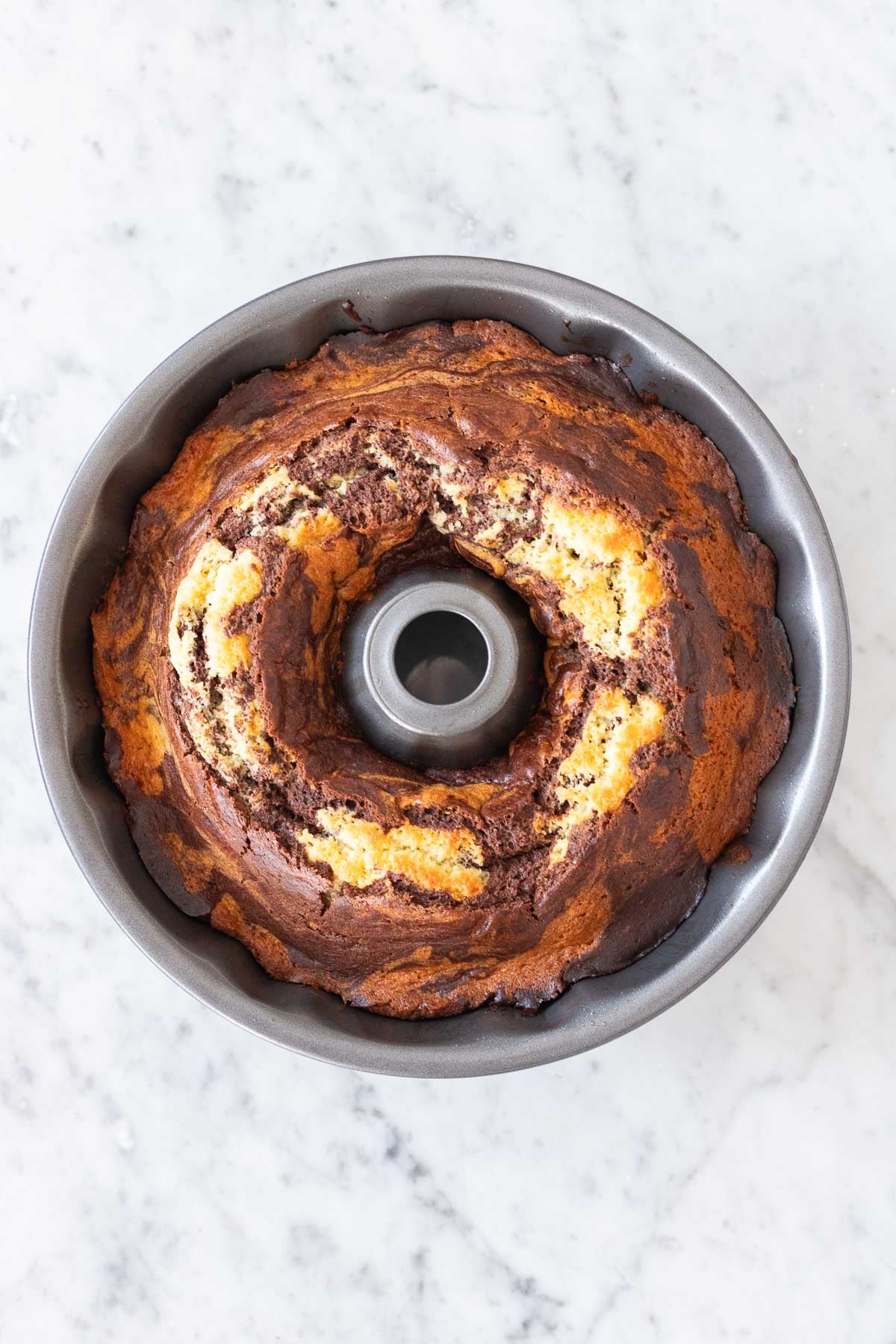 A baked Marmorkuchen in a bundt cake pan.