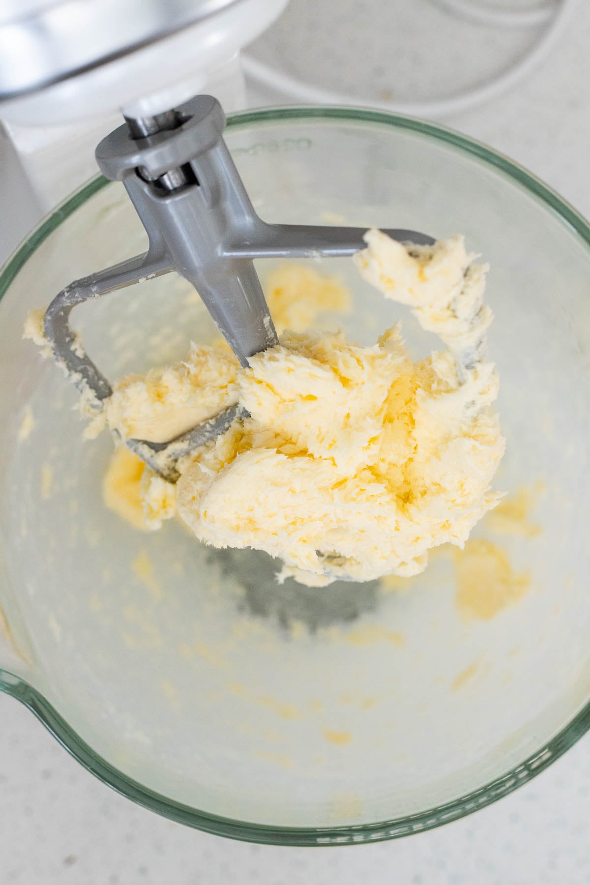 Creaming the butter and sugar in a mixing bowl.