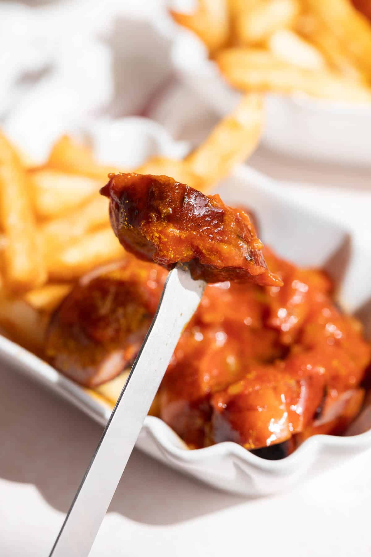 A sausage piece on a skewer.